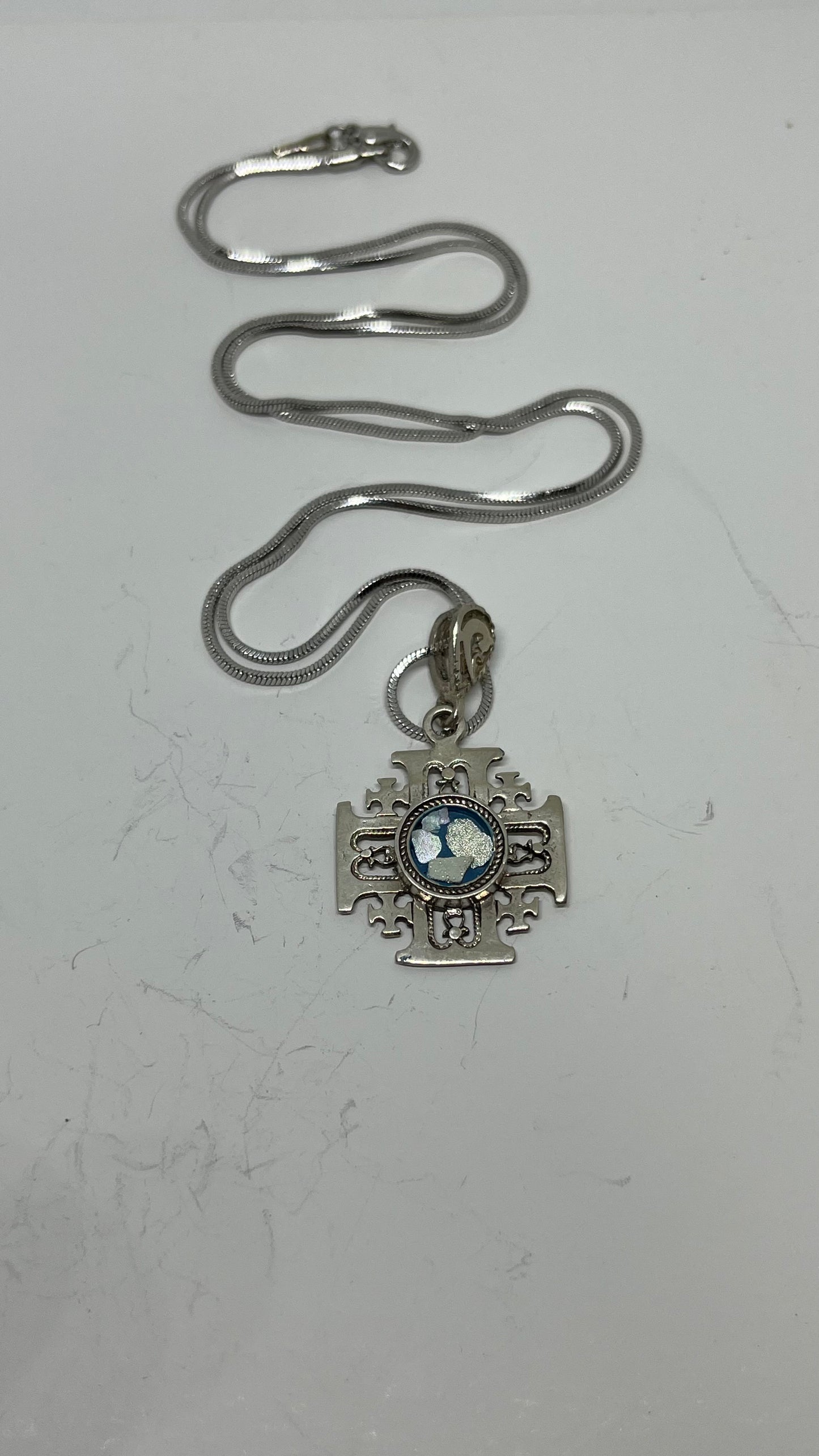Eternal Reflections: Roman Glass in Silver Jerusalem Cross Pendant