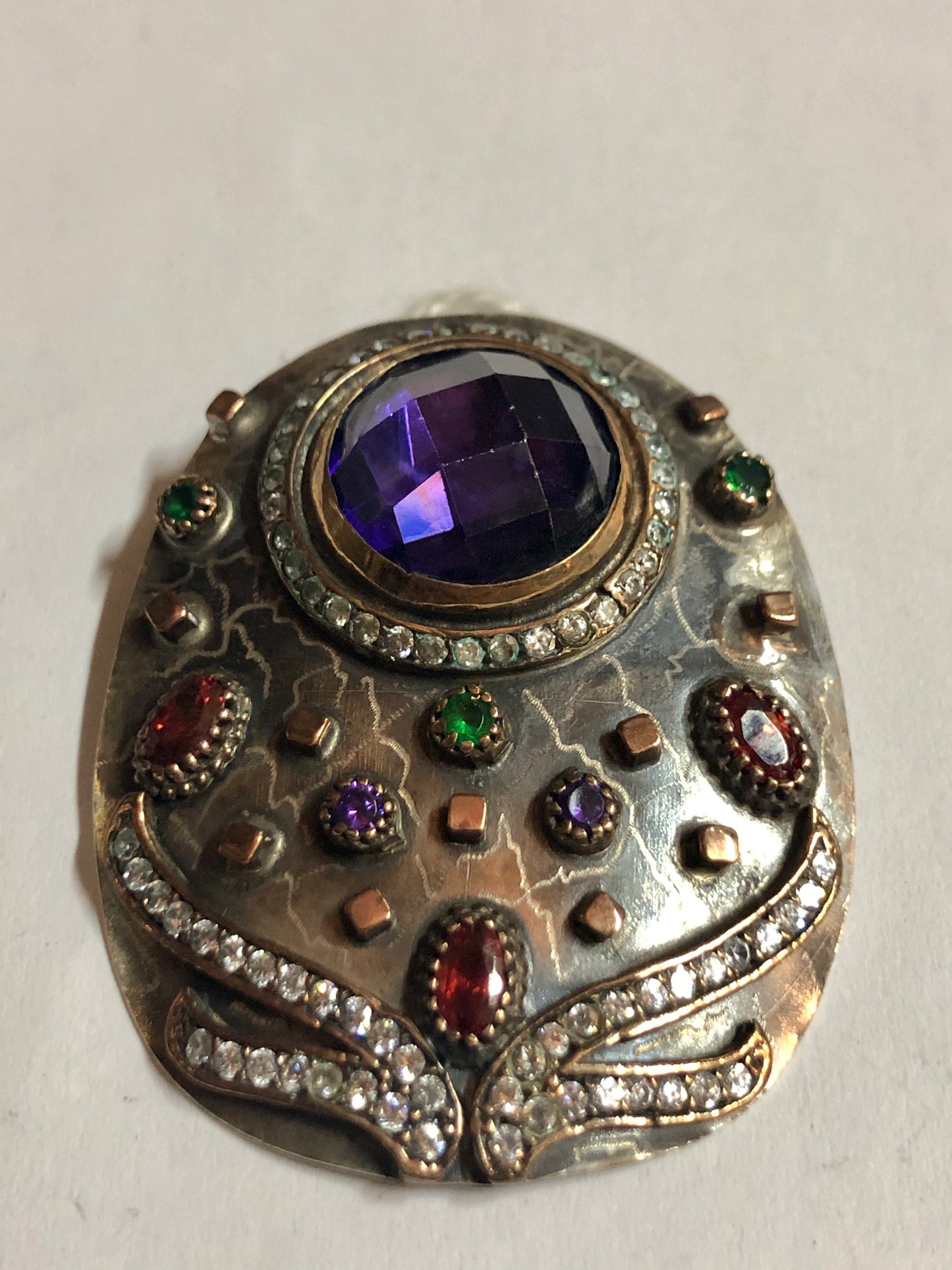 A 925 Silver Pendant with Sapphire stones.