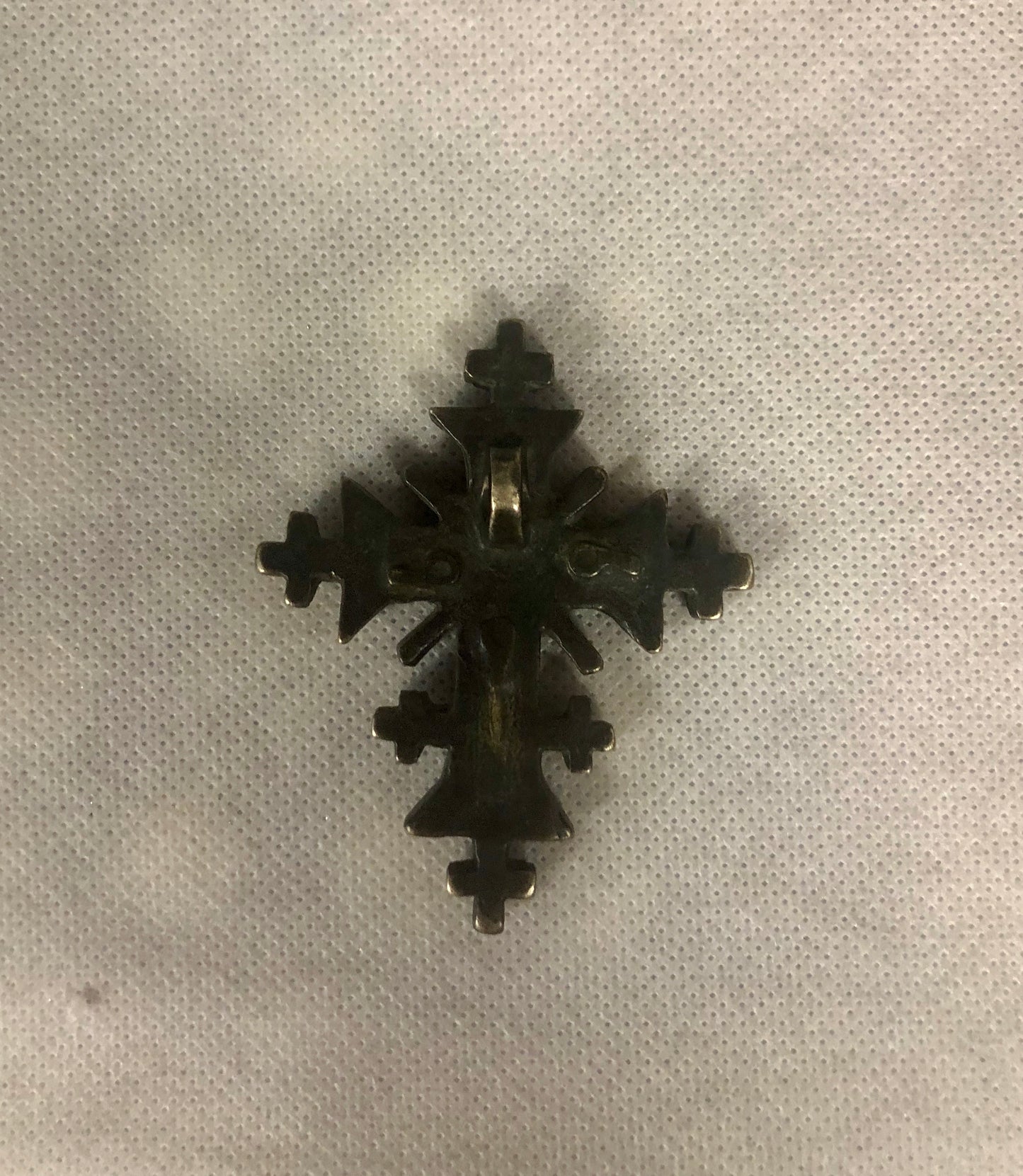 A 925 silver cross pendant.