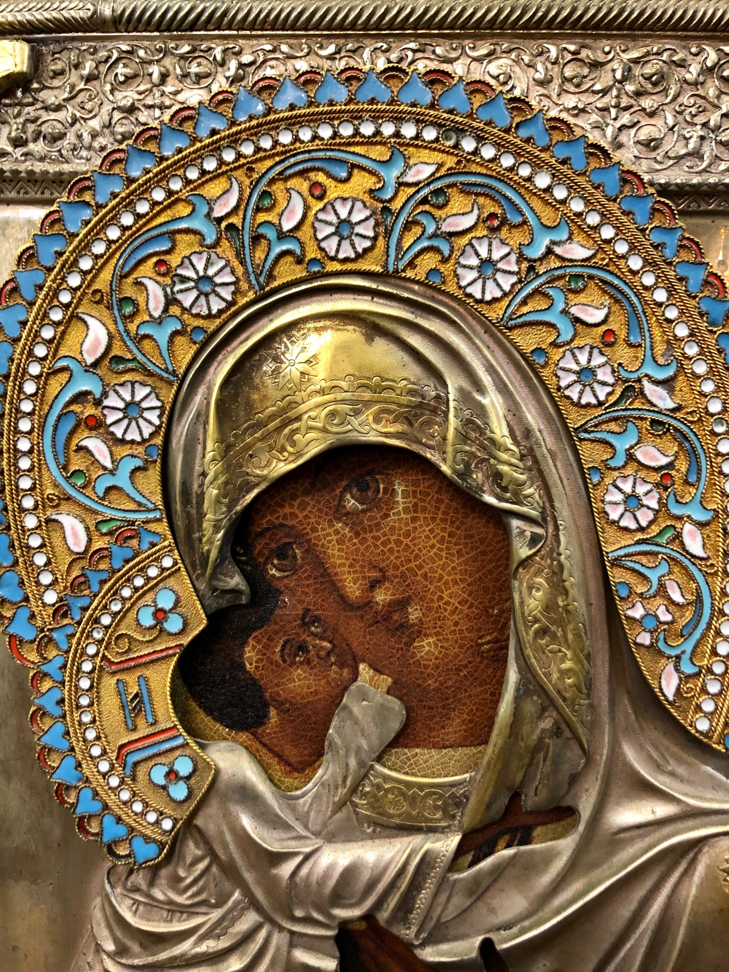 A Russian Enameled-Silver Stamped Pair of the Wedding icon of Jesus Christ and Mother of God 19th Century.