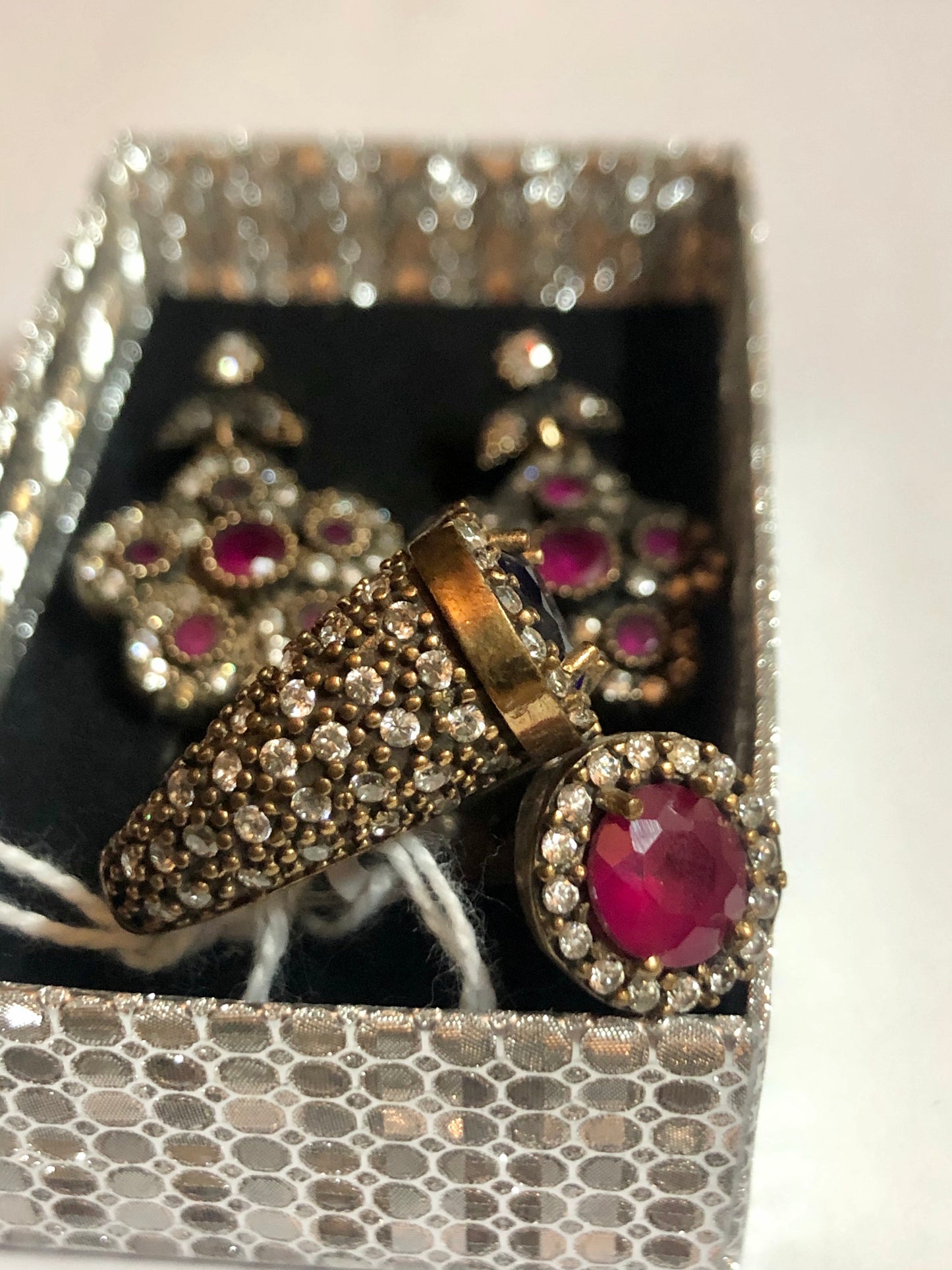 A 925 silver set of a ring and earrings with Sapphire stones.