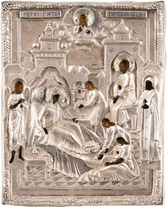 A SMALL ICON SHOWING THE NATIVITY OF THE MOTHER OF GOD WITH A SILVER OKLAD