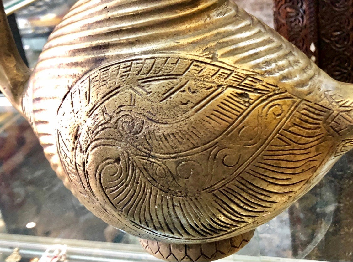 A Golden Bronze Jog displayed in the shape of a Goose. Handmade Bronze Item.