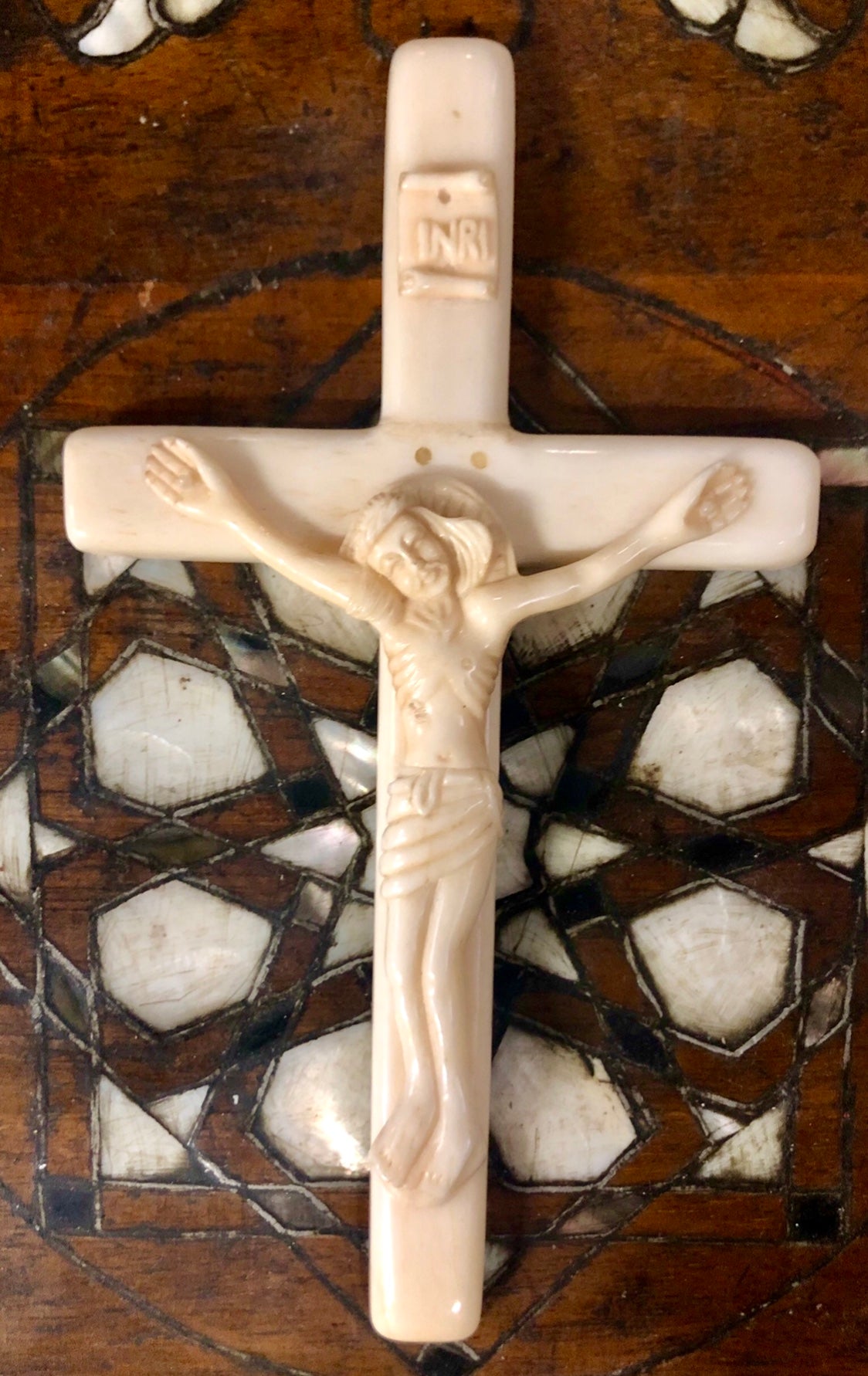 A handmade Jesus statue placed on the Cross, made of Ivory. Late 17th Century.