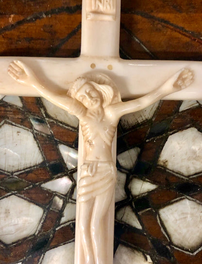 A handmade Jesus statue placed on the Cross, made of Ivory. Late 17th Century.