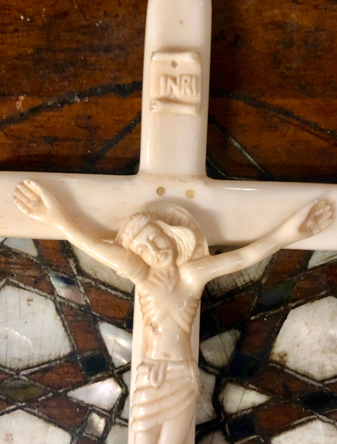 A handmade Jesus statue placed on the Cross, made of Ivory. Late 17th Century.