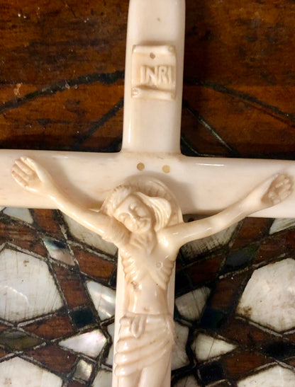 A handmade Jesus statue placed on the Cross, made of Ivory. Late 17th Century.