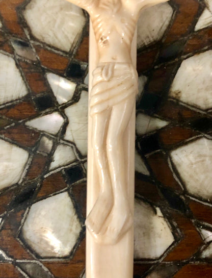 A handmade Jesus statue placed on the Cross, made of Ivory. Late 17th Century.