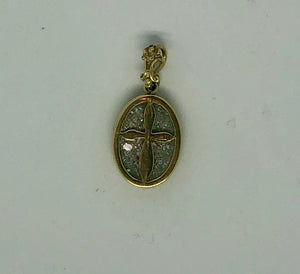 A Roman Glass Pendant with a golden Cross placed carefully on the glass, 14k.