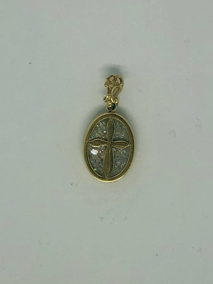 A Roman Glass Pendant with a golden Cross placed carefully on the glass, 14k.