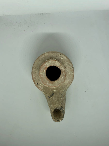 A Hellenistic Oil Lamp, ancient Pottery. 330 BC.