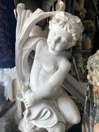 A Boy sitting on tree branch, handmade Marble Statue. 19th Century (1880)