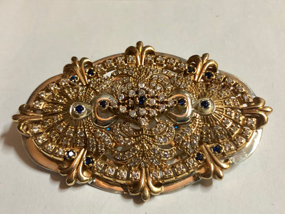 A 925 Silver Brooch with Sapphire stones.