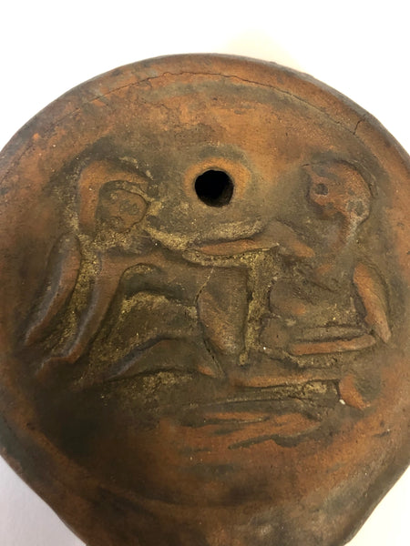 An Authentic Roman Oil lamp of a Man and a Woman embracing. 63 B.C.E.