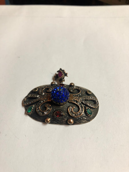 A 925 Silver Pendant with Sapphire stones.