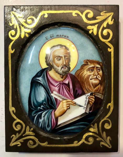 A Russian Enameled icon of St. Mark The Evangelist, wood carved.