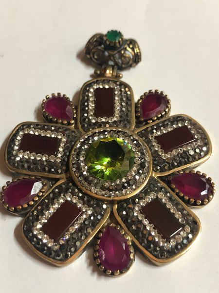 A 925 Silver Pendant with Sapphire stones.