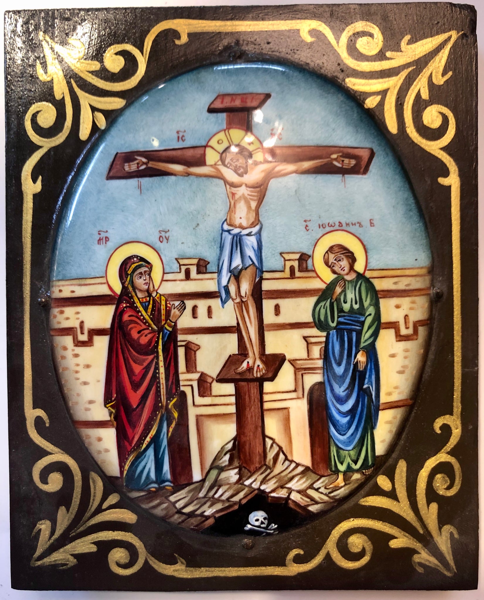 A Russian Enameled wood carved Icon of Jesus’ Crucifixion.
