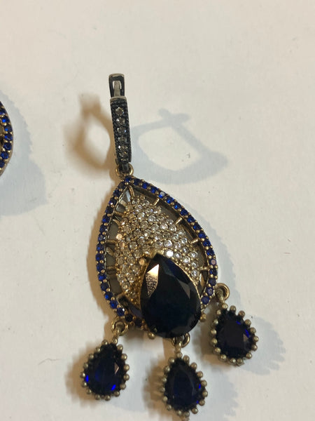 A 925 Silver set of a Pendant and Earrings with Sapphire Stones.
