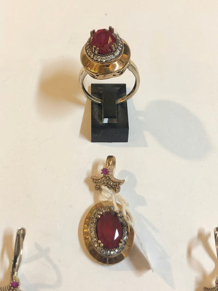 A 925 Silver ser of a Ring, Earrings and a Pendant with Sapphire stones.