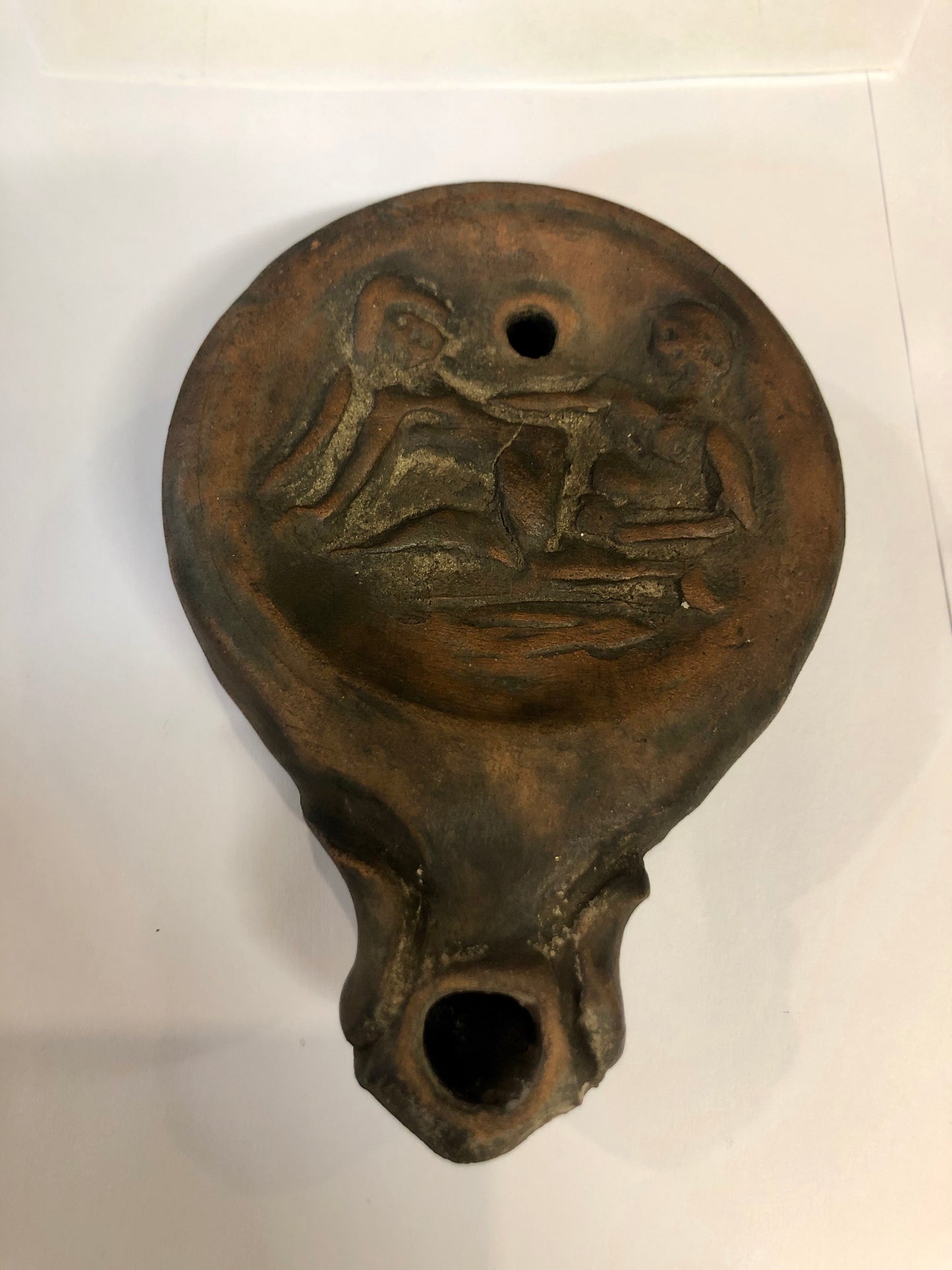 An Authentic Roman Oil lamp of a Man and a Woman embracing. 63 B.C.E.