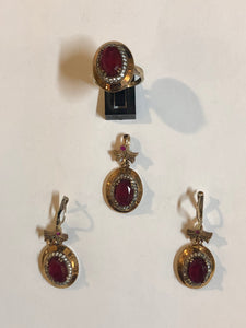 A 925 Silver ser of a Ring, Earrings and a Pendant with Sapphire stones.