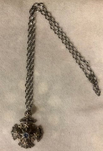 A 925 silver cross pendant with a silver chain.