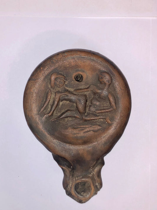 An Authentic Roman Oil lamp of a Man and a Woman embracing. 63 B.C.E.