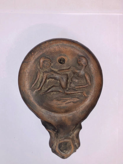 An Authentic Roman Oil lamp of a Man and a Woman embracing. 63 B.C.E.