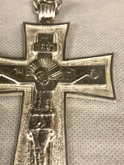 A 925 Silver cross with silver chain.