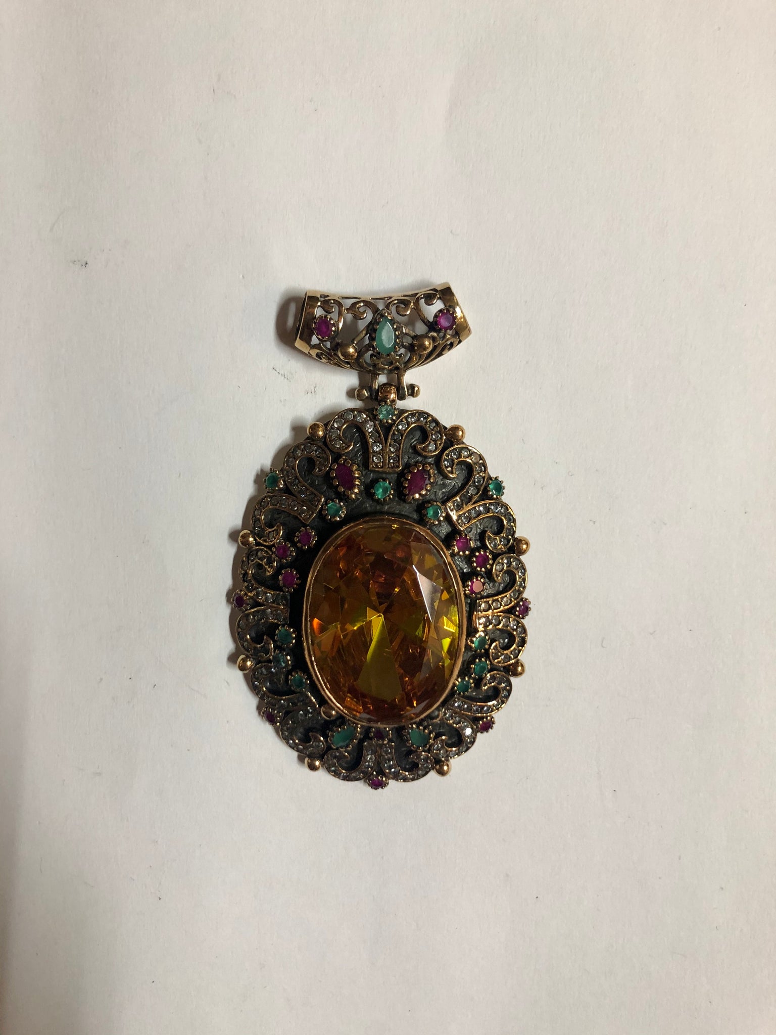 A 925 Silver Pendant with Sapphire stones.