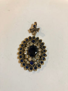 A 925 Silver Pendant with Sapphire stones.